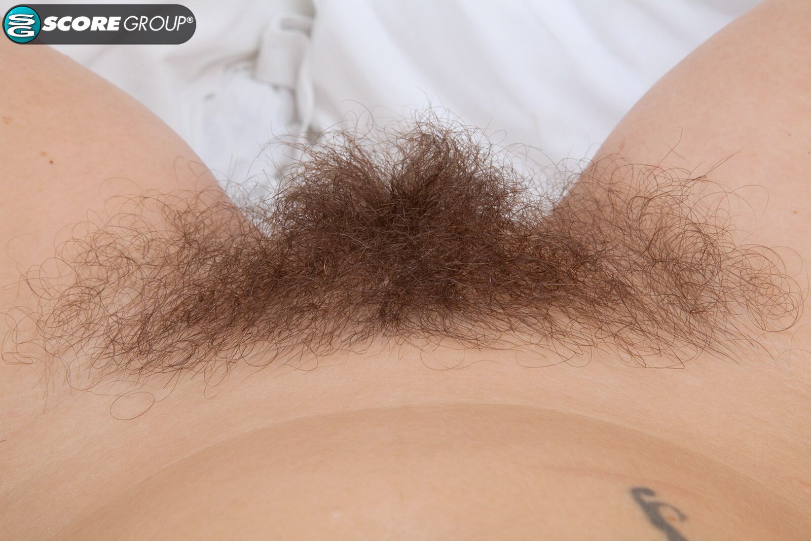 BUSH BABY ELLE IS A BLONDE UP TOP AND A BRUNETTE IN HER PANTIES. HER SWEET HAIRY MUFF IS PINK AS WATERMELON.