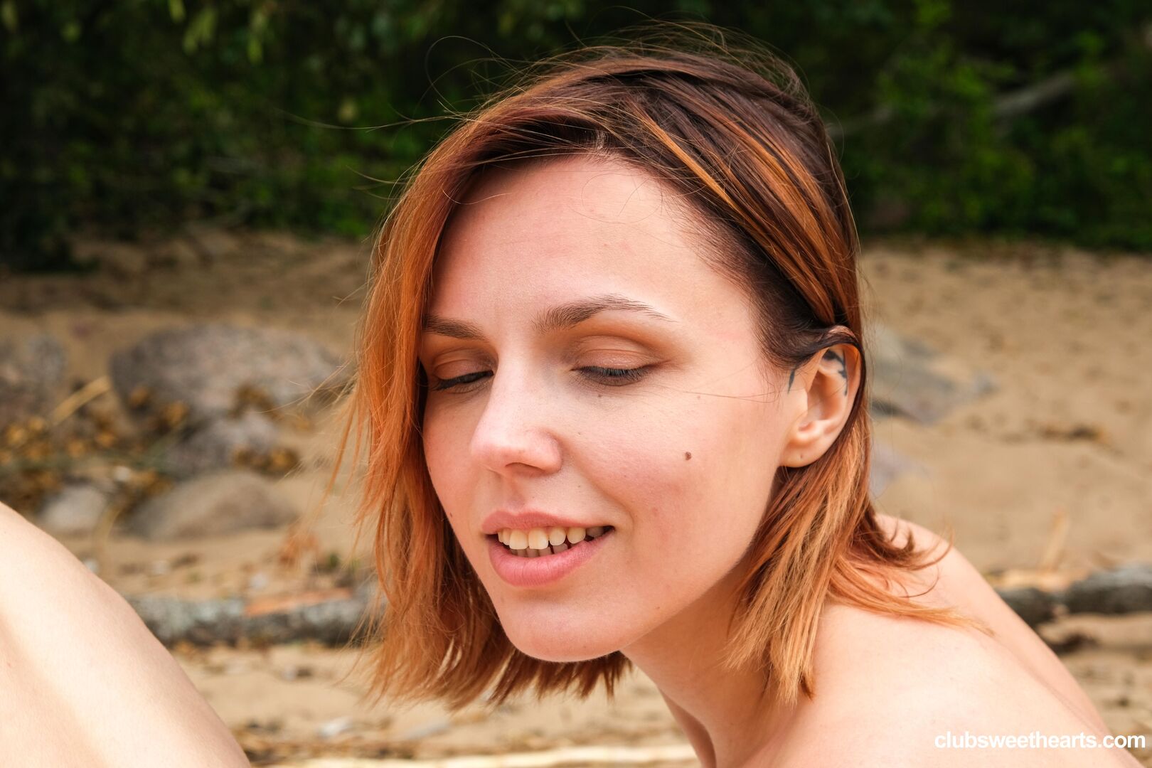 Lesbians playing on the beach