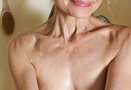 HORNY HOUSEWIFE ENJOYS SHOWERING AND MASTURBATING HER PUSSY AT THE SAME TIME