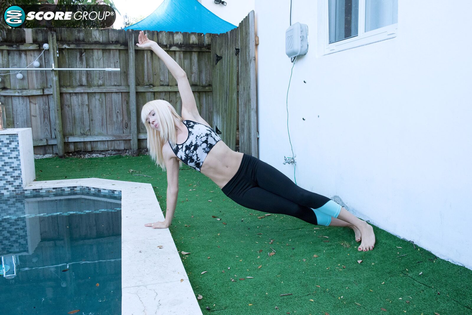 Yoga chick Sveera stretches outside and then loses her yoga clothes, spreads and fingers her snatch.