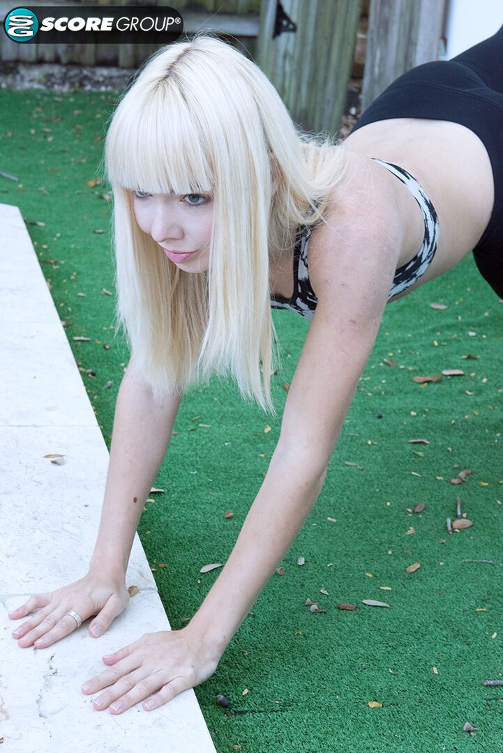 Yoga chick Sveera stretches outside and then loses her yoga clothes, spreads and fingers her snatch.