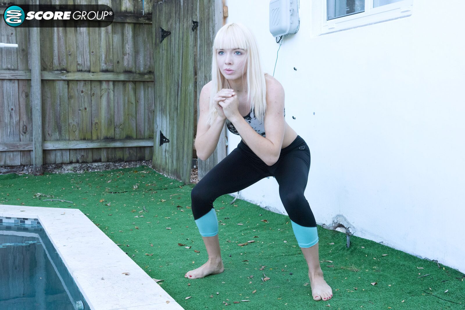 Yoga chick Sveera stretches outside and then loses her yoga clothes, spreads and fingers her snatch.
