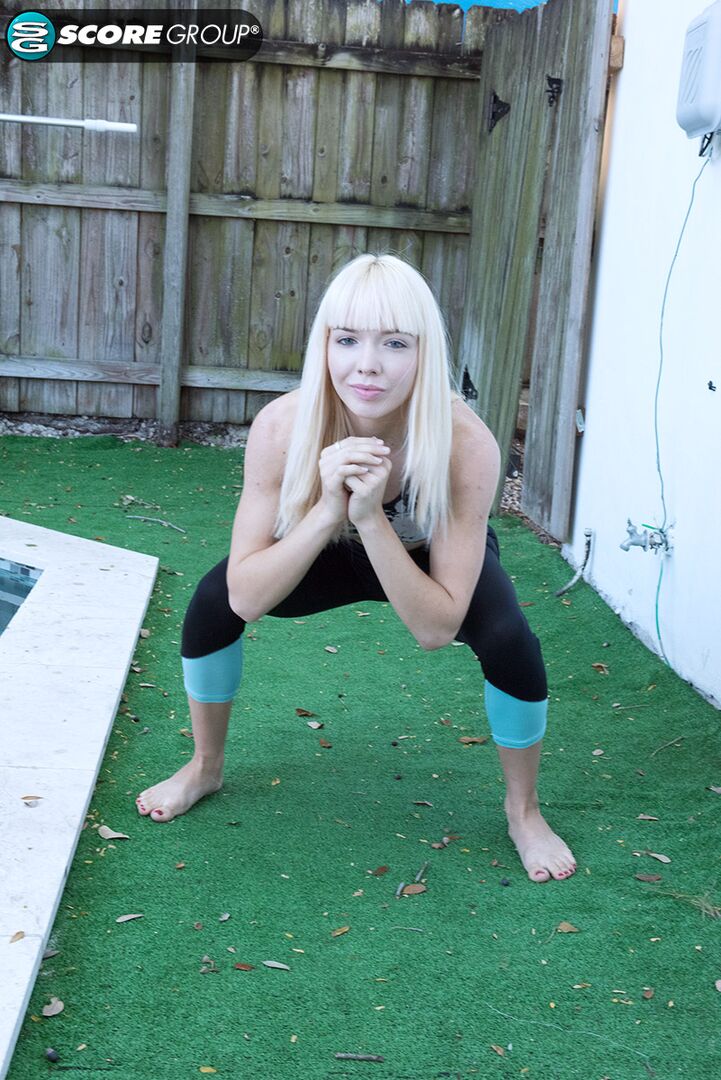 Yoga chick Sveera stretches outside and then loses her yoga clothes, spreads and fingers her snatch.