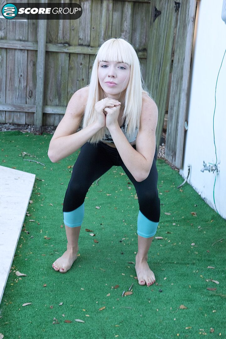 Yoga chick Sveera stretches outside and then loses her yoga clothes, spreads and fingers her snatch.