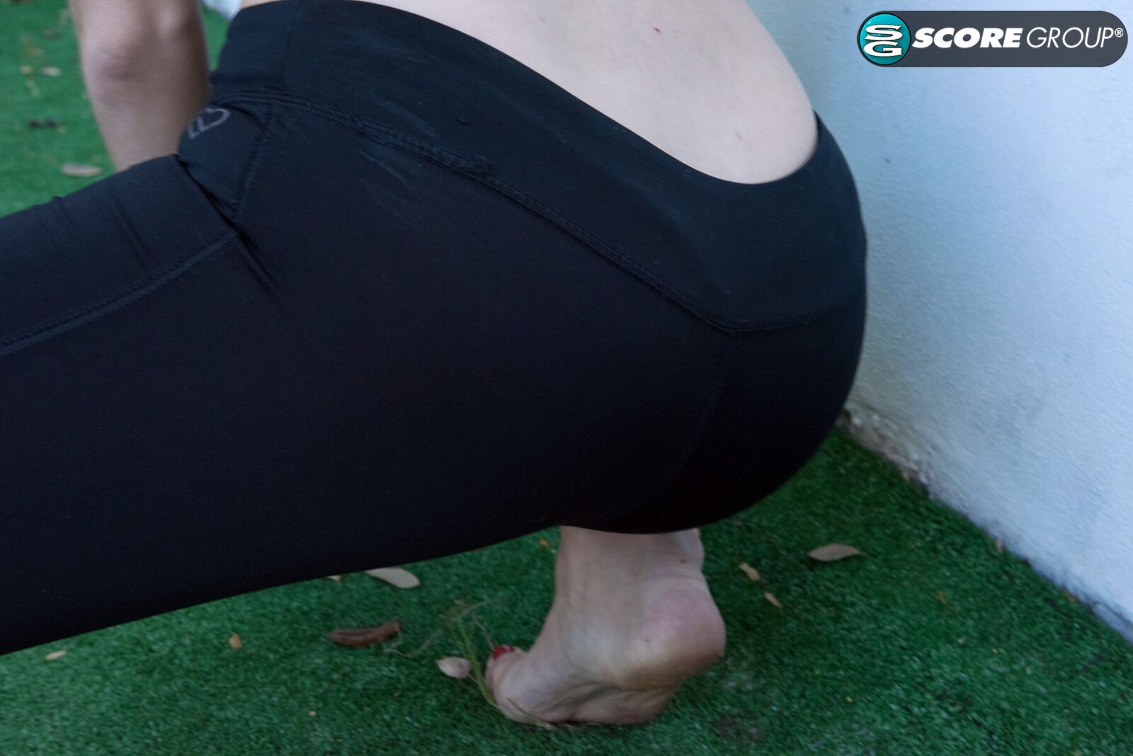 Yoga chick Sveera stretches outside and then loses her yoga clothes, spreads and fingers her snatch.