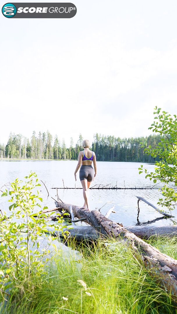 Outdoorsy blonde with cute, perky tits drops her yoga pants and spreads her pussy next to a lake.
