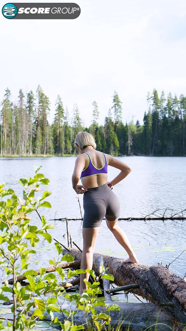 Outdoorsy blonde with cute, perky tits drops her yoga pants and spreads her pussy next to a lake.