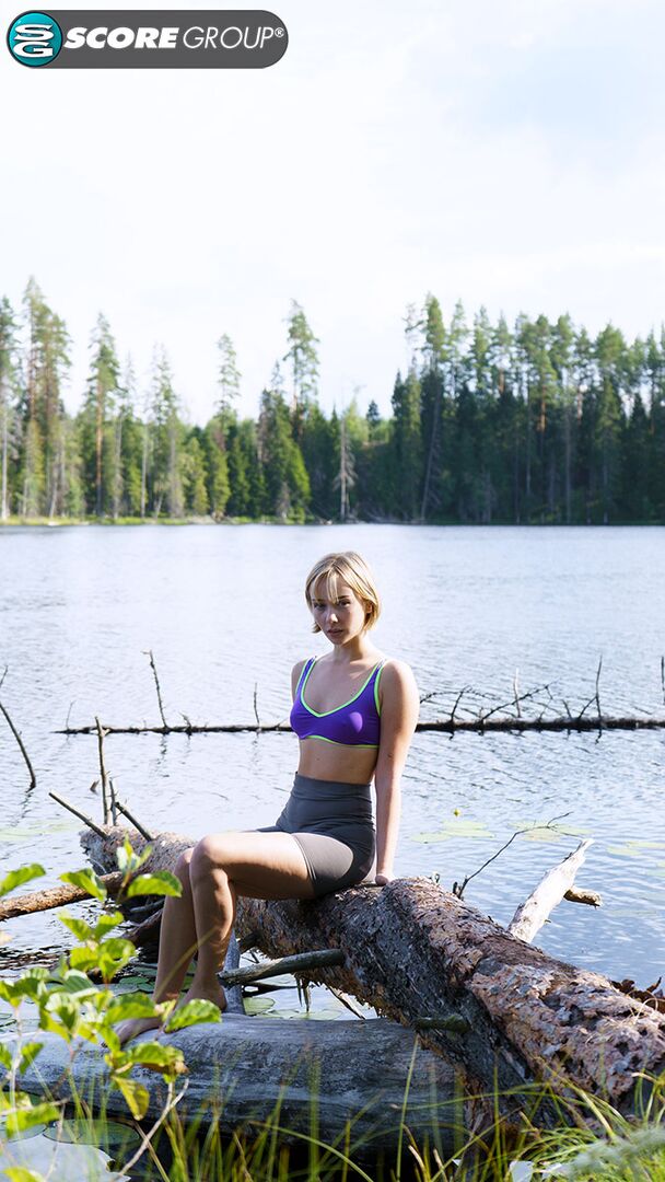 Outdoorsy blonde with cute, perky tits drops her yoga pants and spreads her pussy next to a lake.