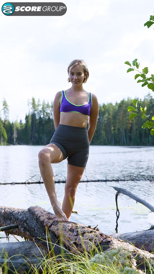Outdoorsy blonde with cute, perky tits drops her yoga pants and spreads her pussy next to a lake.