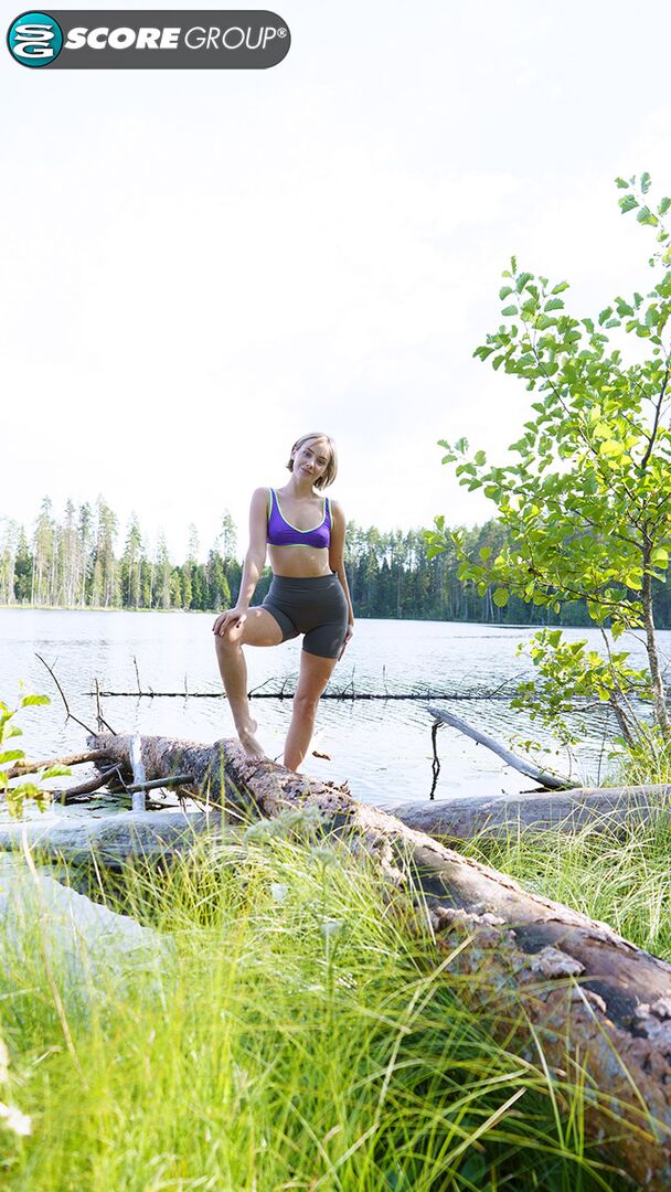 Outdoorsy blonde with cute, perky tits drops her yoga pants and spreads her pussy next to a lake.
