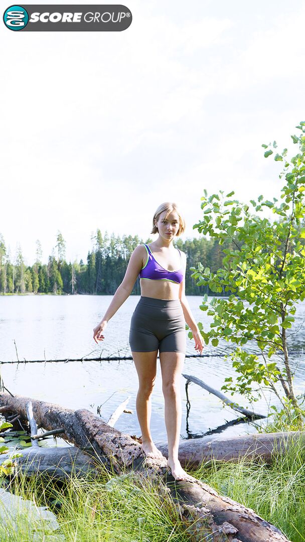 Outdoorsy blonde with cute, perky tits drops her yoga pants and spreads her pussy next to a lake.