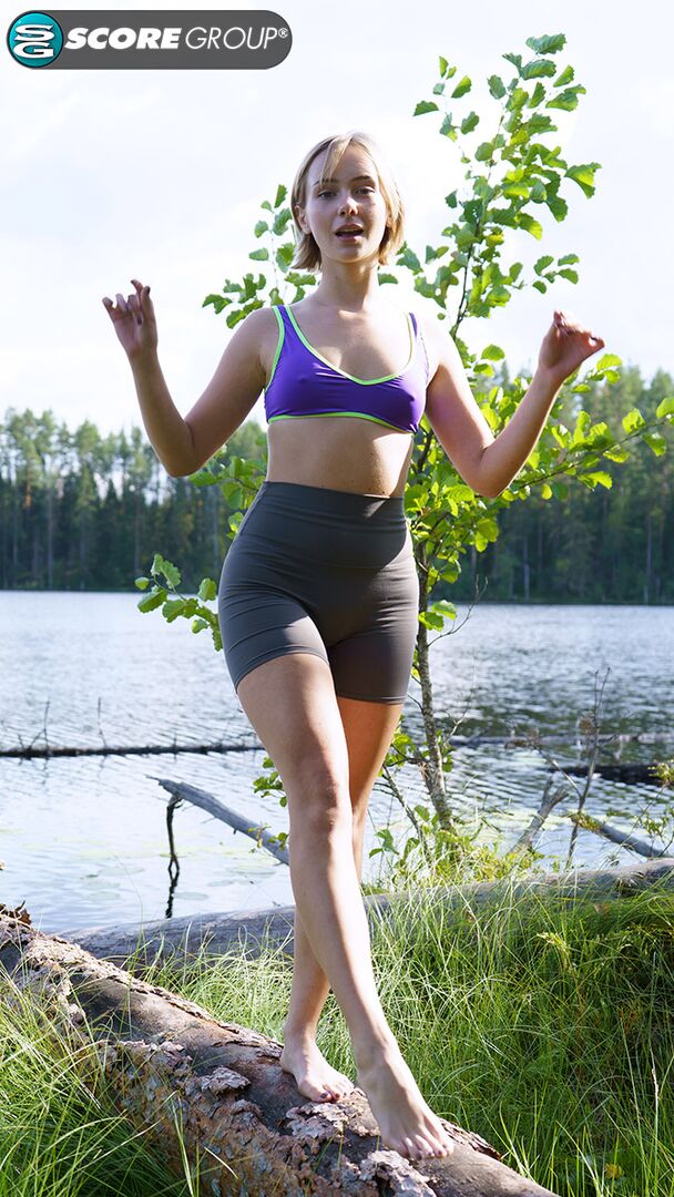 Outdoorsy blonde with cute, perky tits drops her yoga pants and spreads her pussy next to a lake.