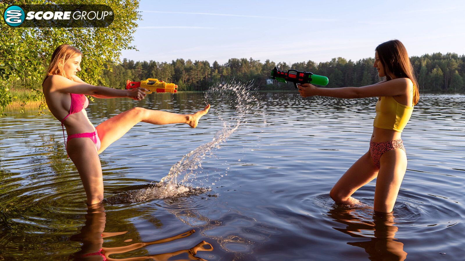 Erika and Margo, both 19, have hardcore lesbian sex outdoors complete with tit sucking, pussy licking and fingering next to a lake.