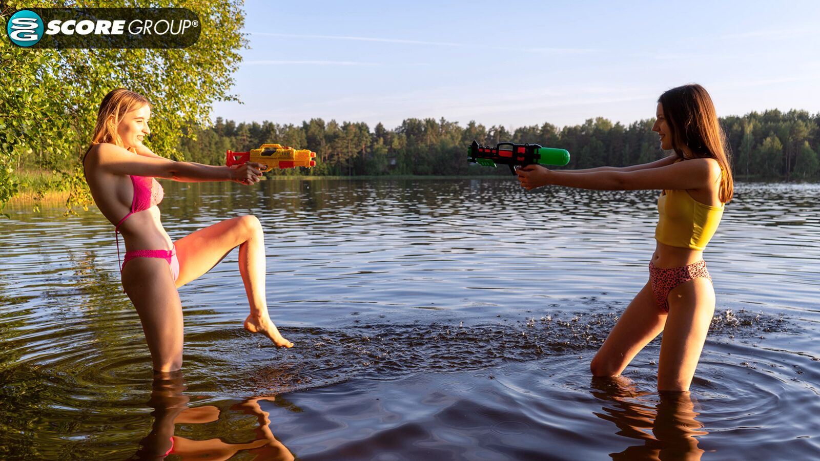 Erika and Margo, both 19, have hardcore lesbian sex outdoors complete with tit sucking, pussy licking and fingering next to a lake.