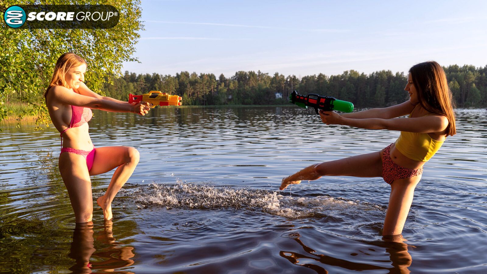 Erika and Margo, both 19, have hardcore lesbian sex outdoors complete with tit sucking, pussy licking and fingering next to a lake.