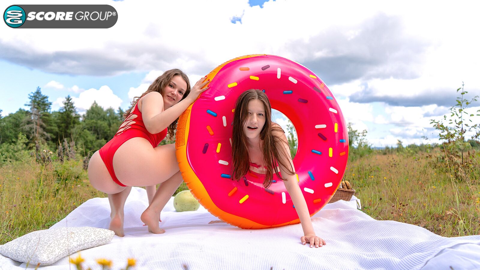 Margo Von Teese and Simona splash each other in their bikinis in a lake before eating each other out on the beach.