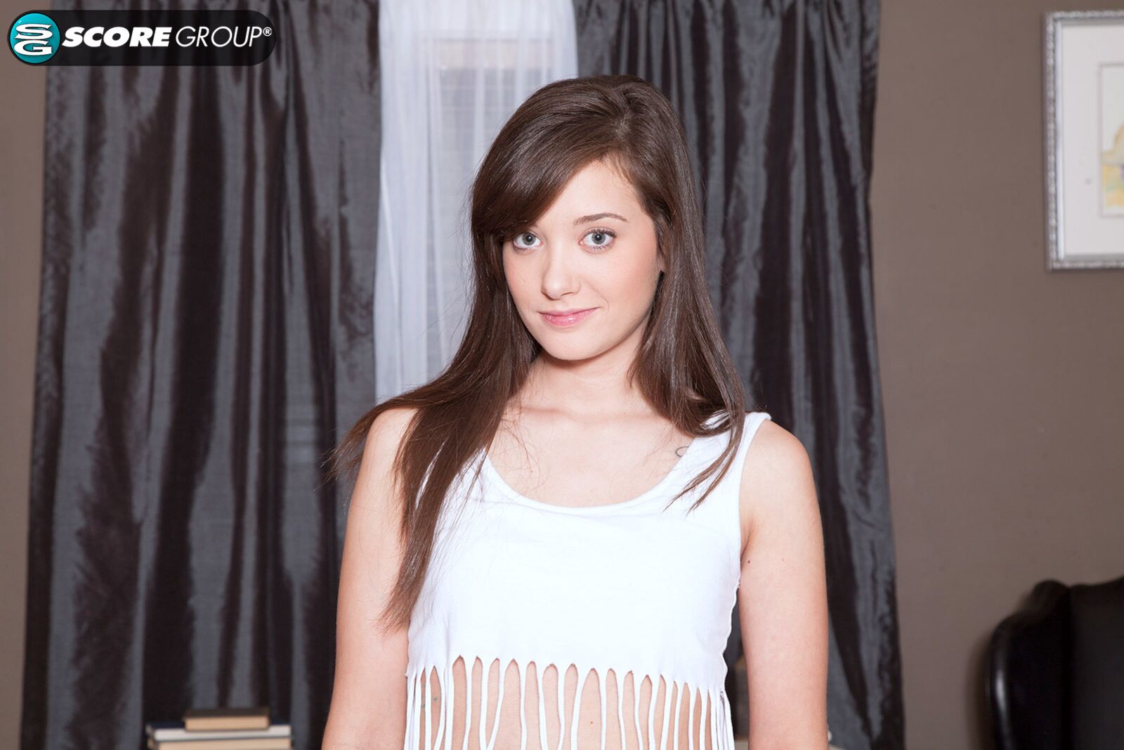 Gia Page is a skinny brunette with a cute smirk and a pink pussy.