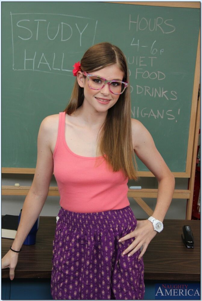 Student Lara Brookes fucking in the desk with her glasses