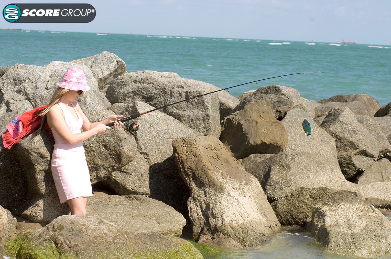 Ashlyn Lee goes fishing, but she would rather enjoy a masturbation session on the sand. She gets caught on-camera by our voyeur videographer.