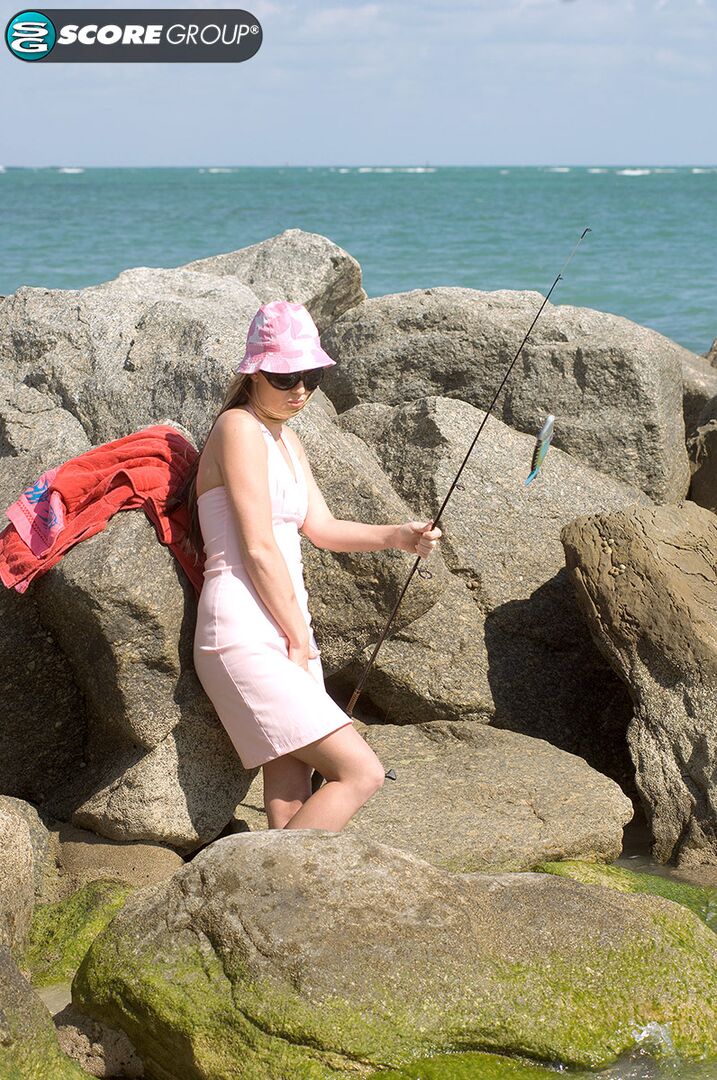 Ashlyn Lee goes fishing, but she would rather enjoy a masturbation session on the sand. She gets caught on-camera by our voyeur videographer.
