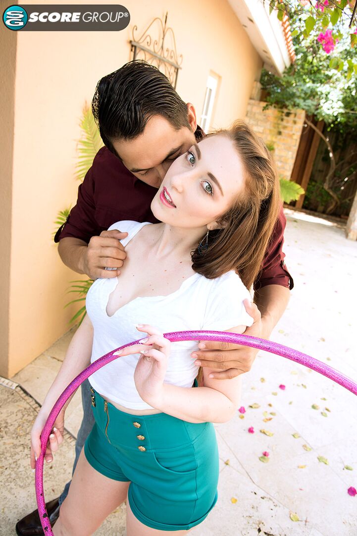 Lillith Adams shows off her Hula Hoop skills. Then, she swivels her hips on a stud's cock until he blasts her with a cum facial.
