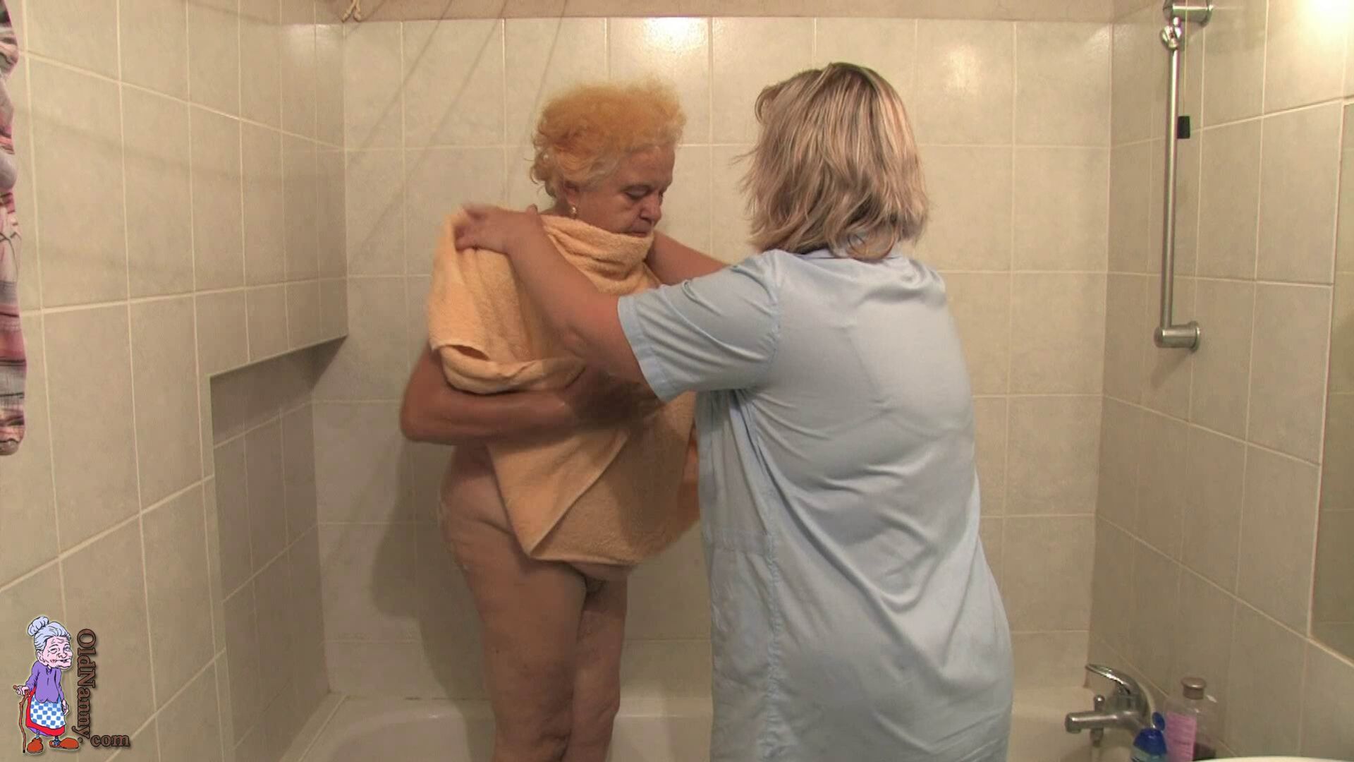 HERMINE GETTING BATHED BY HER CARETAKER