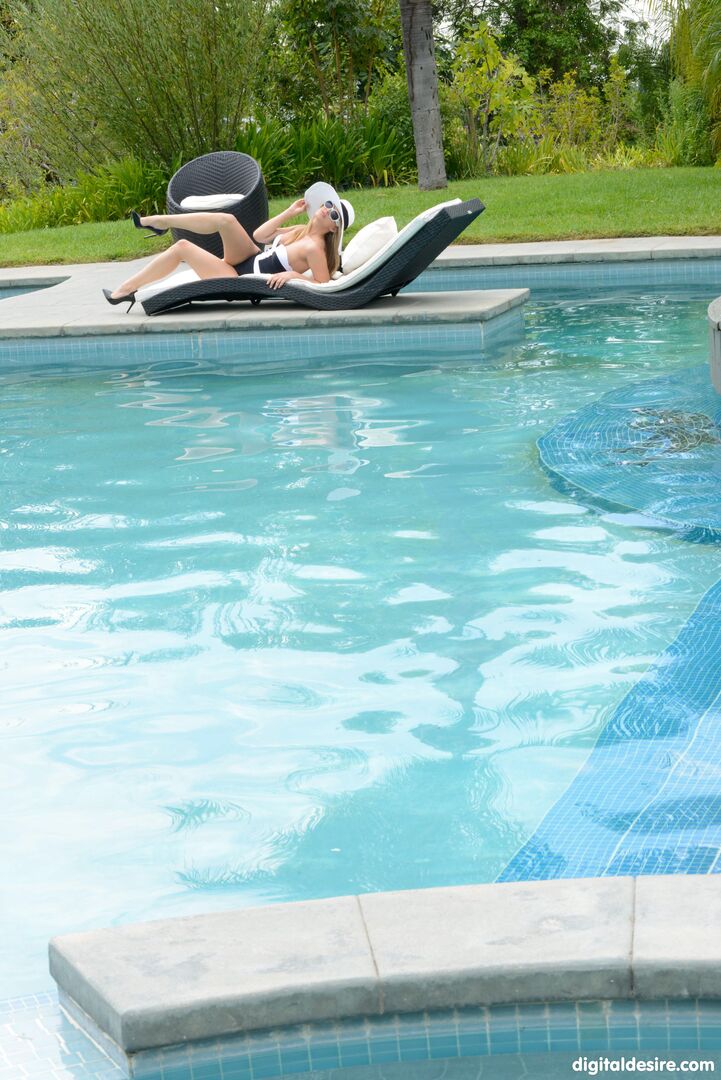 Erotic Jillian Janson playing at poolside