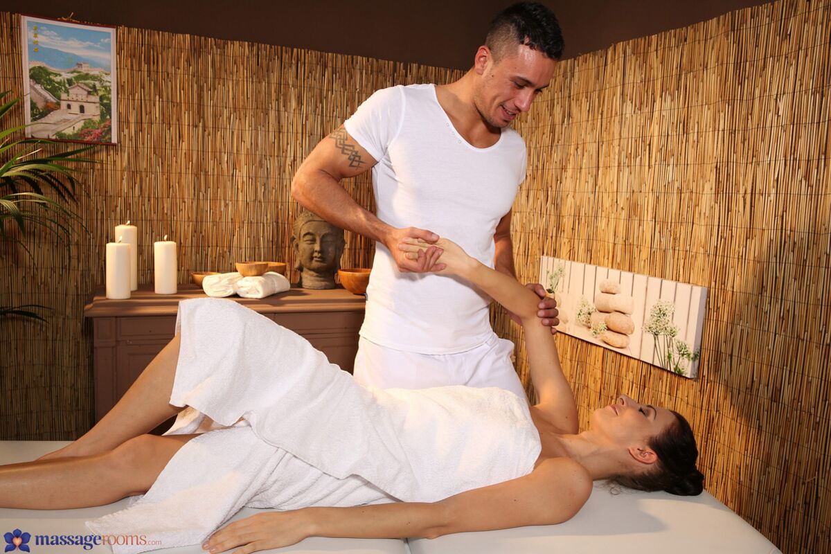 Brunette rides masseur's thick dick