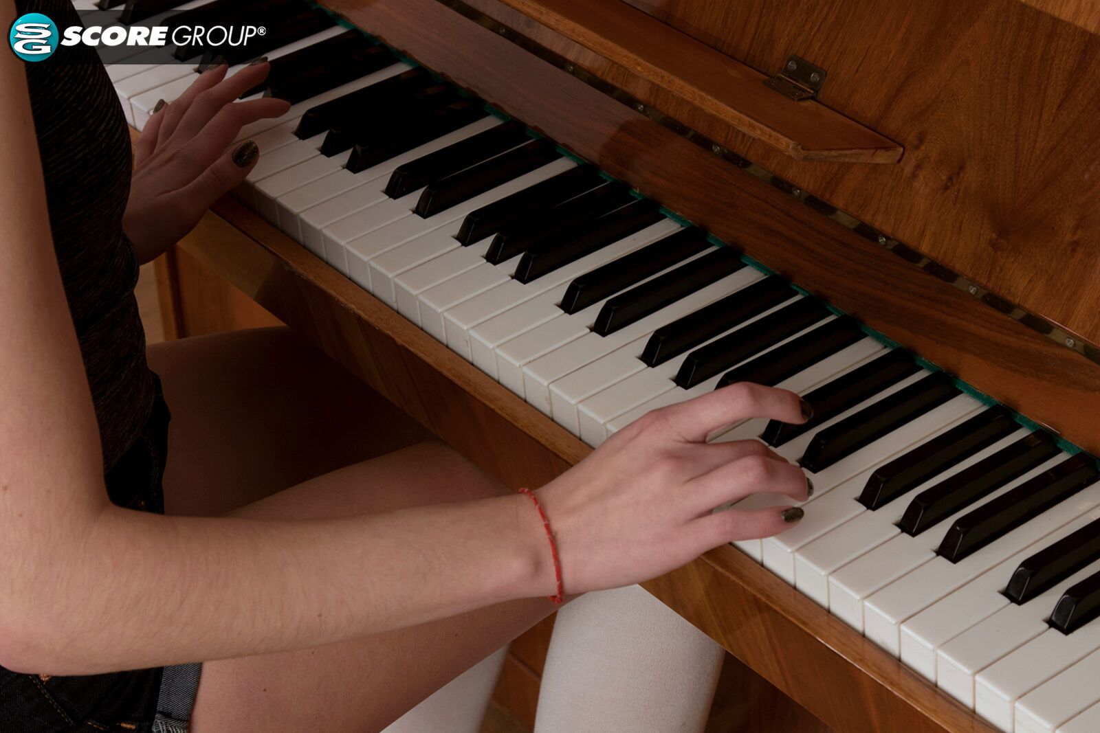 Adel, a cutie with long, flowing brunette hair, plays the piano and then fingers her tight slit.