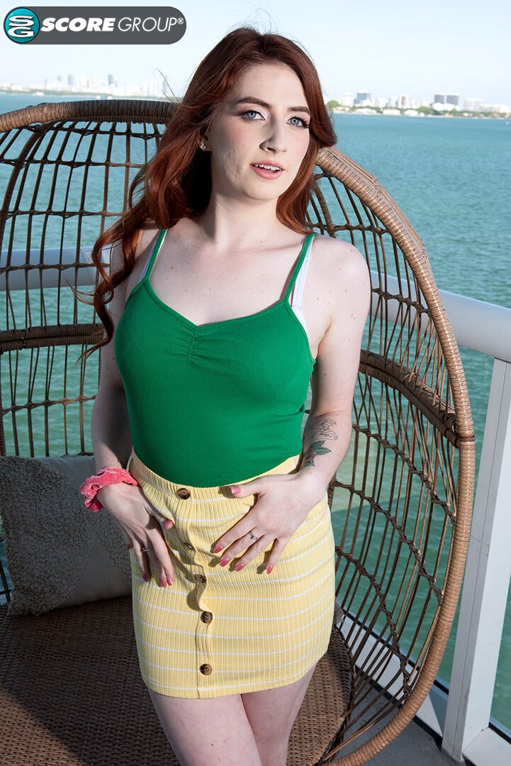 Aria is a young, natural redhead who exposes her pussy outdoors.