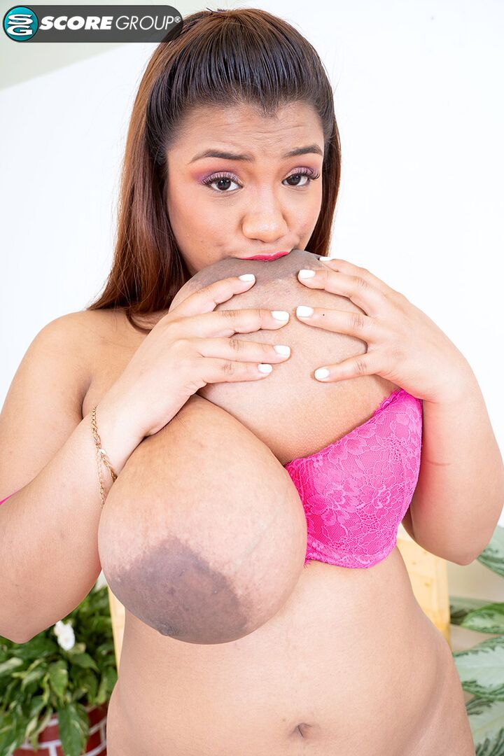 Huge-titted Angie Bravo sucks her tits and fucks her pussy