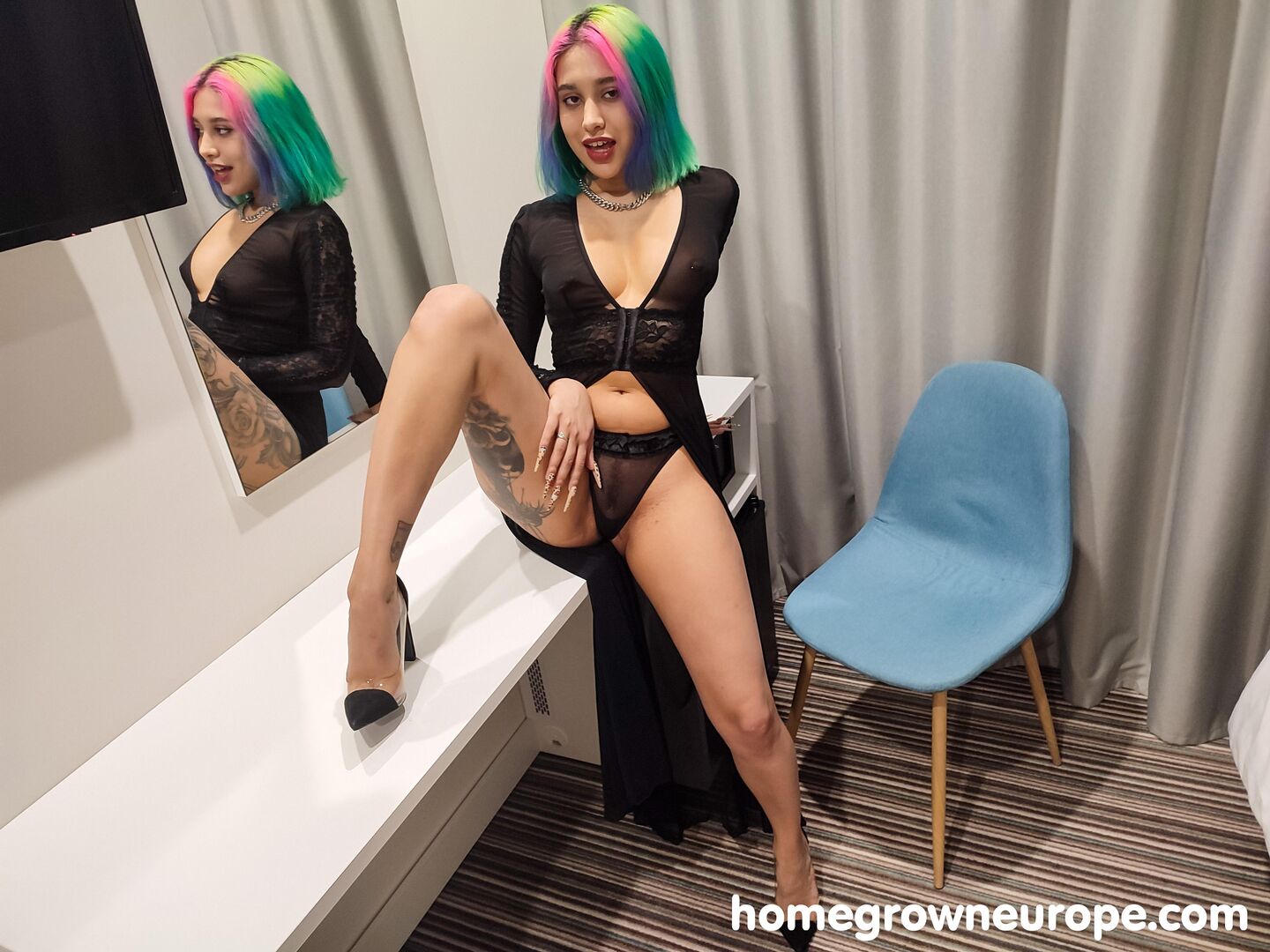 Pierced rainbow haired babe fucking
