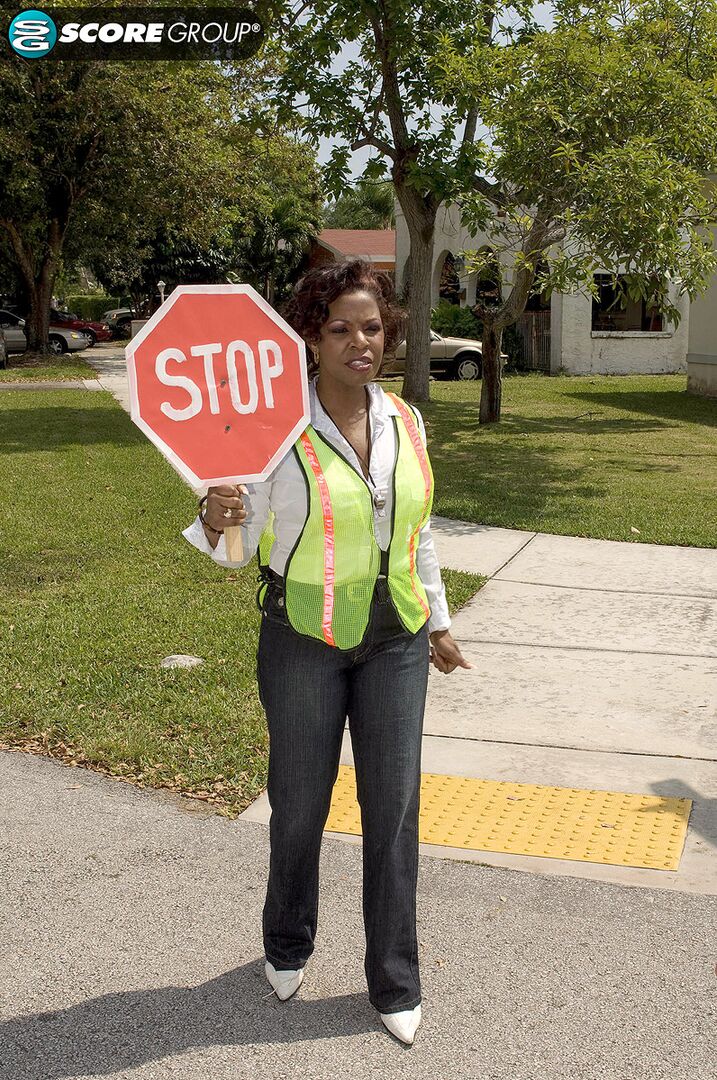 A cock is guided into crossing guard Shawna Winters' pussy