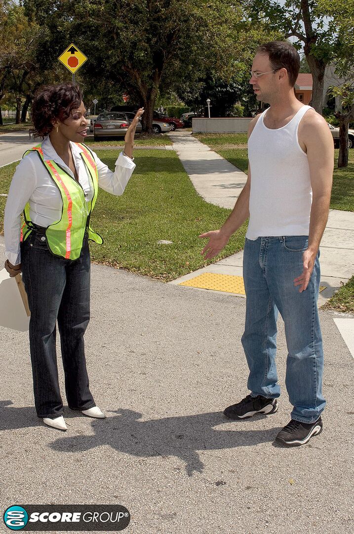 A cock is guided into crossing guard Shawna Winters' pussy