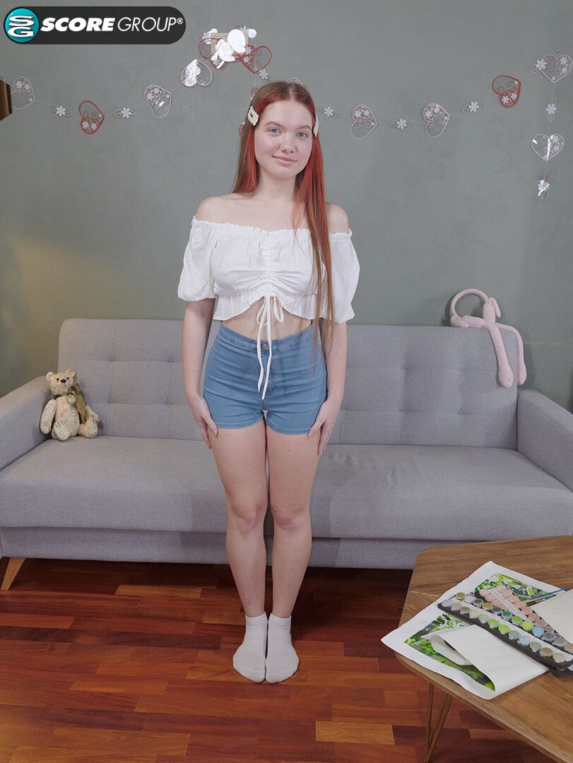 Vivi is a sexy teen with great tits, long legs and an incredibly tight pussy that she fingers upside down on a couch.