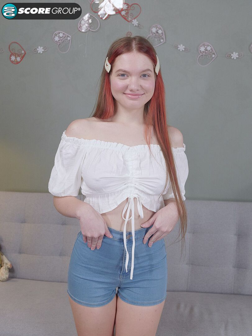 Vivi is a sexy teen with great tits, long legs and an incredibly tight pussy that she fingers upside down on a couch.