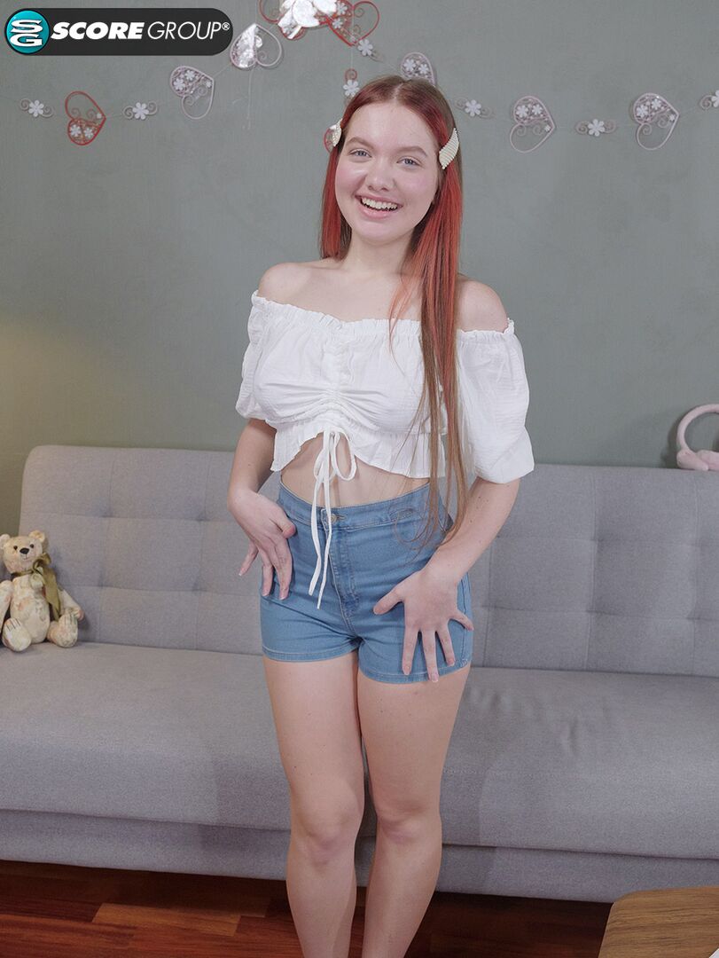 Vivi is a sexy teen with great tits, long legs and an incredibly tight pussy that she fingers upside down on a couch.