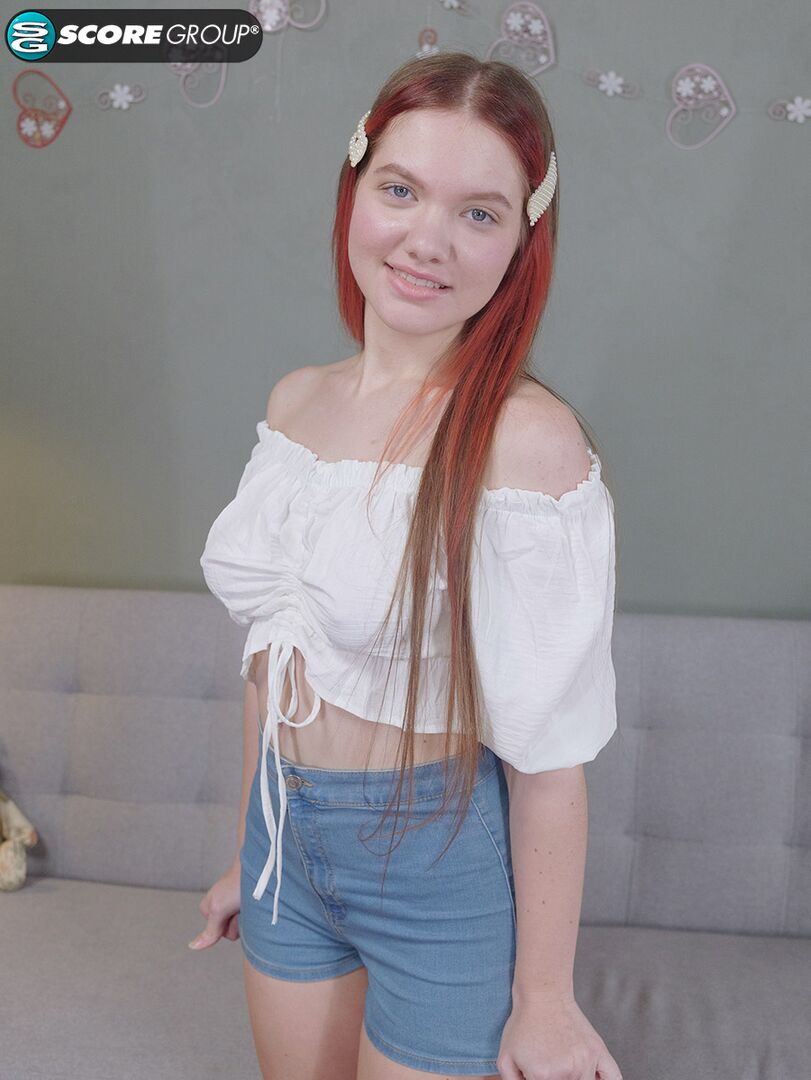 Vivi is a sexy teen with great tits, long legs and an incredibly tight pussy that she fingers upside down on a couch.