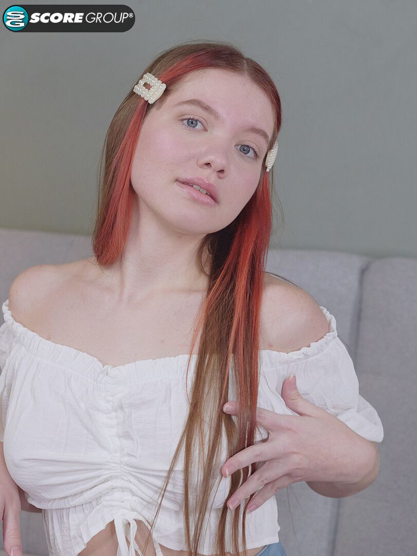 Vivi is a sexy teen with great tits, long legs and an incredibly tight pussy that she fingers upside down on a couch.