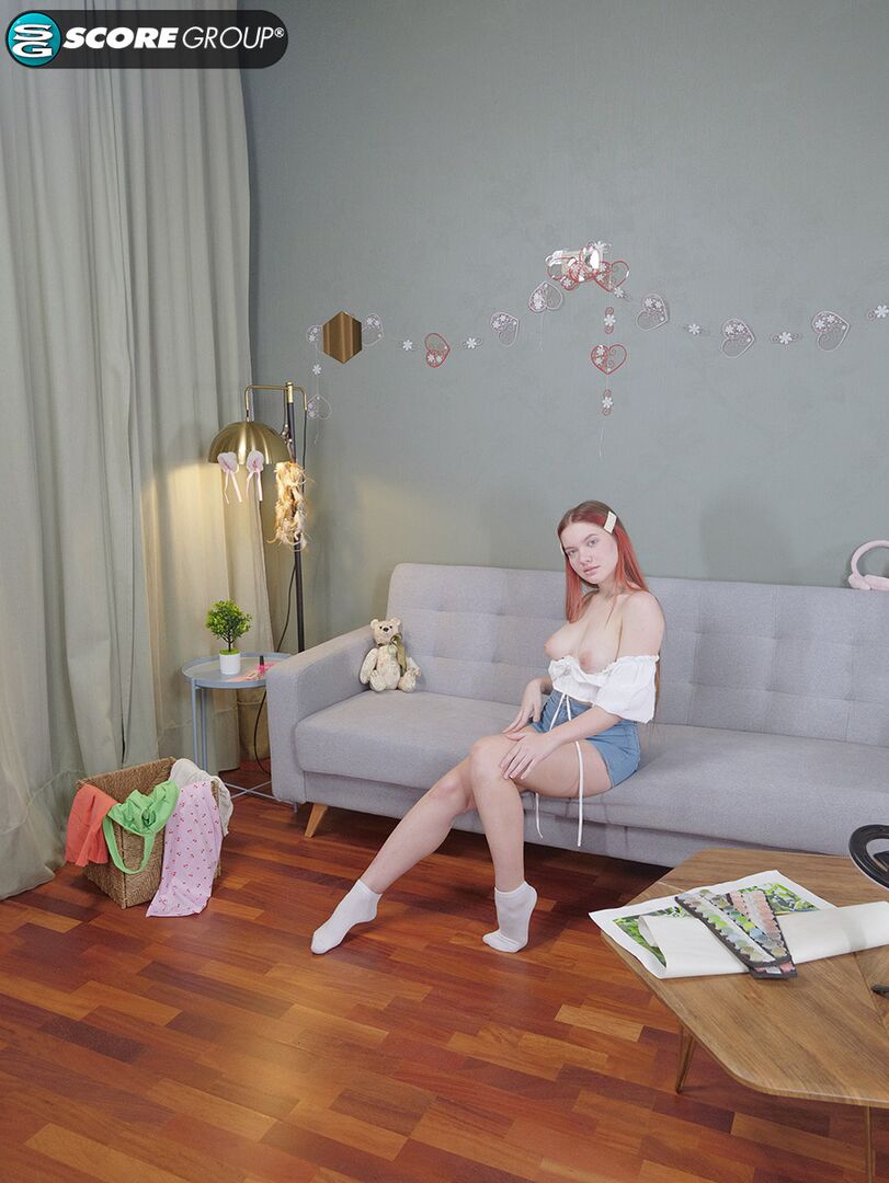 Vivi is a sexy teen with great tits, long legs and an incredibly tight pussy that she fingers upside down on a couch.