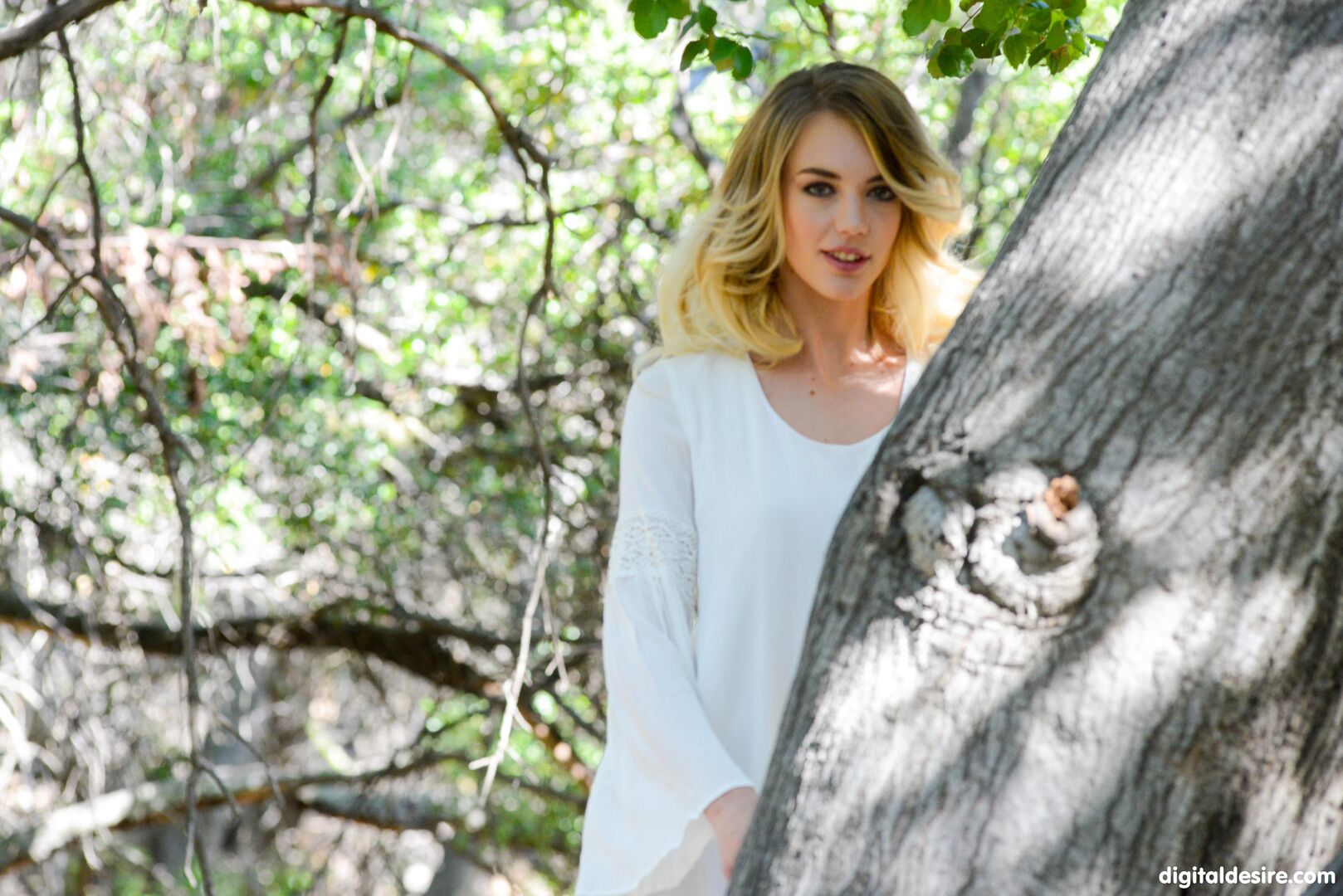 Blonde angel touches herself in the forest