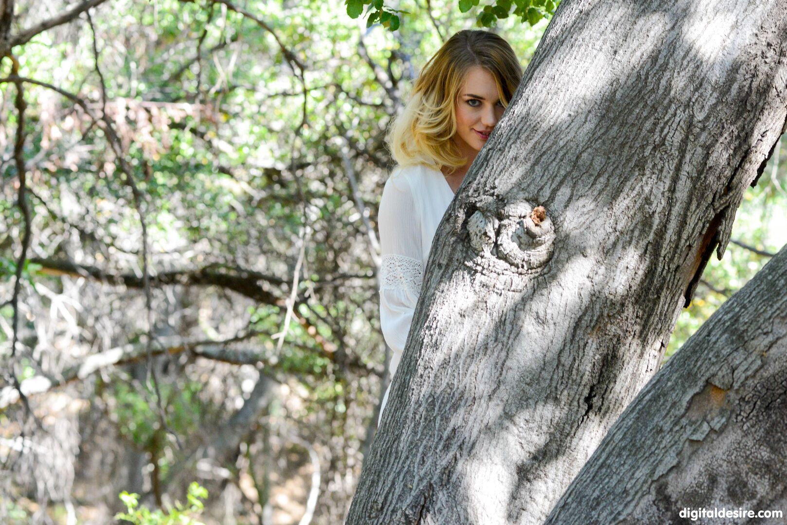 Blonde angel touches herself in the forest