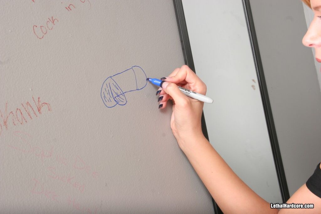 Watch Darcy Tyler Suck Off A Hard Cock Through A Glory Hole