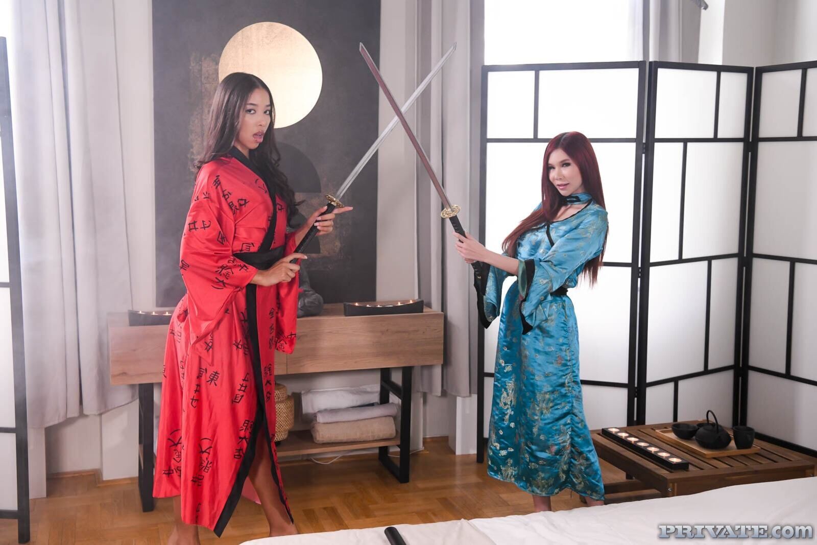Asians Lia Lin and April Máxima, and their masseur's katana