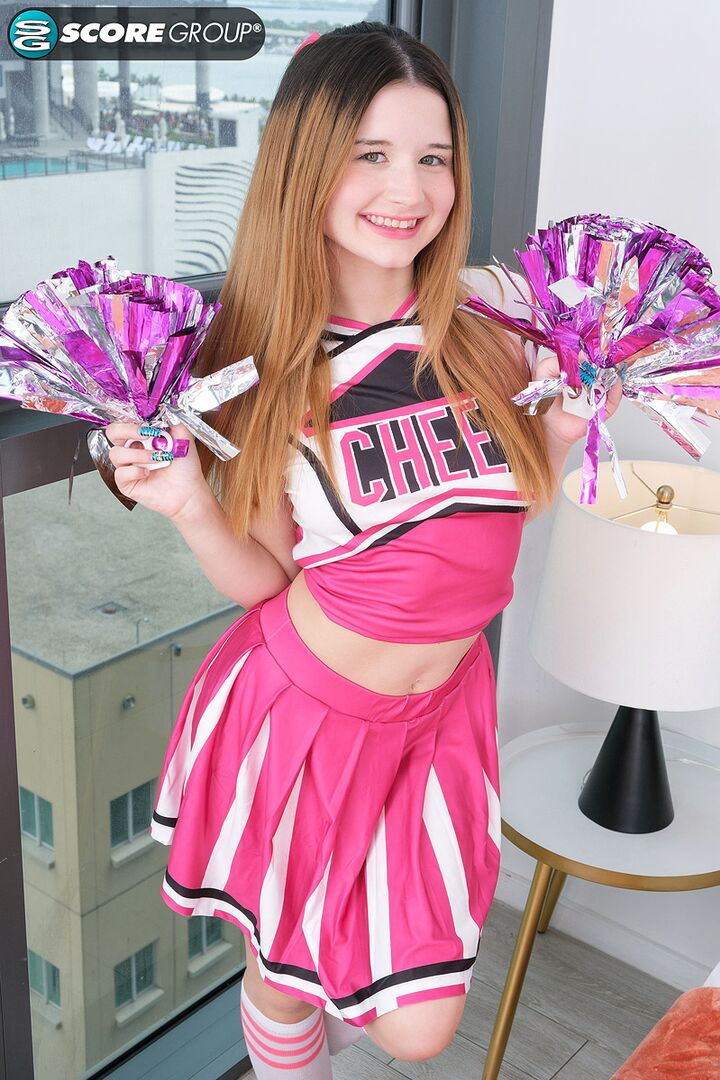 Cheerleader Carly Kiss Shows Off Her Flexible Body Then Deep-Fingers Her Pussy