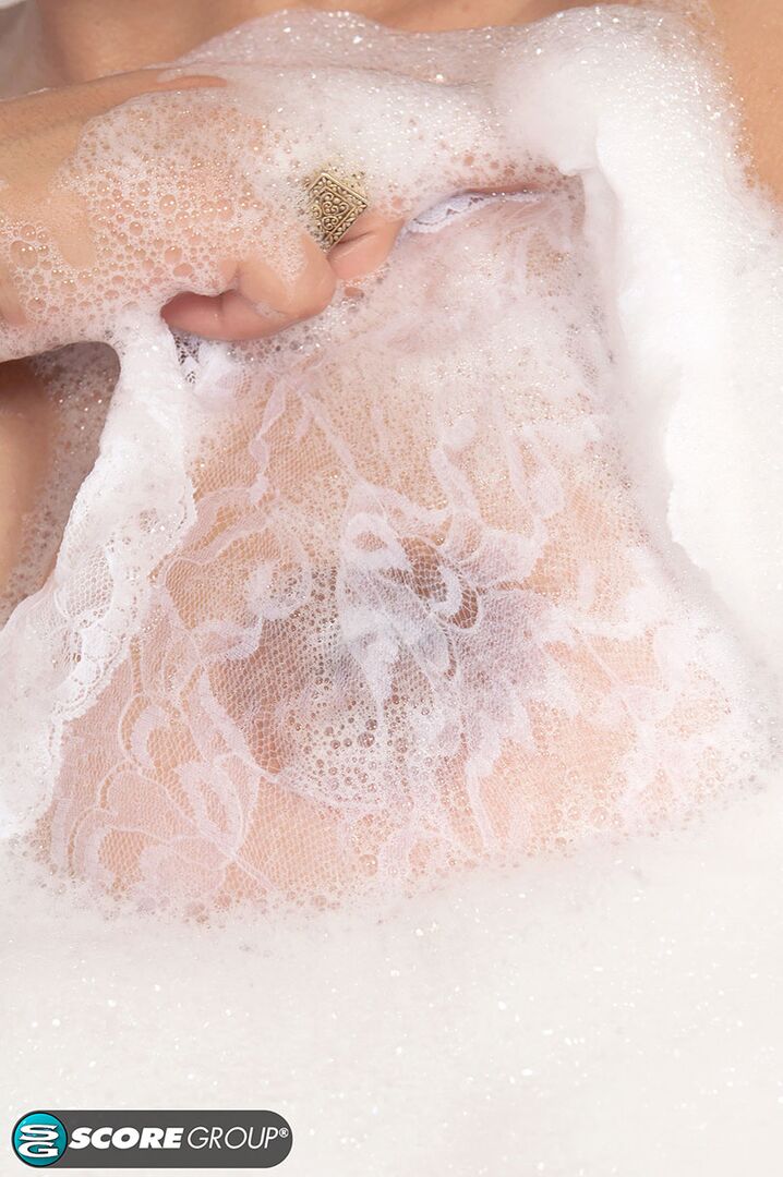 Enjoy a bubble bath with busty beauty Paola Rios