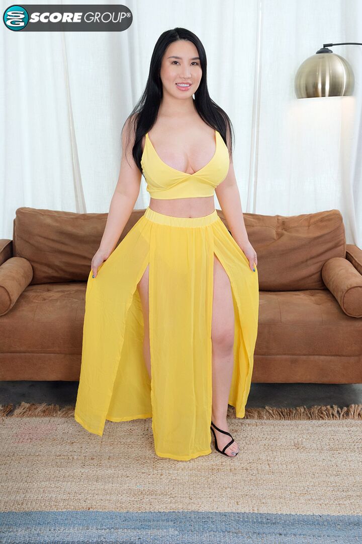 Suki Sin is built thick, with huge tits and a nice big ass. She toys her Asian pussy with a big dildo.