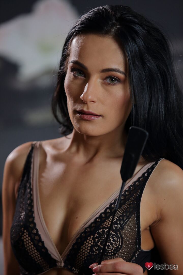 Raven haired siren takes control