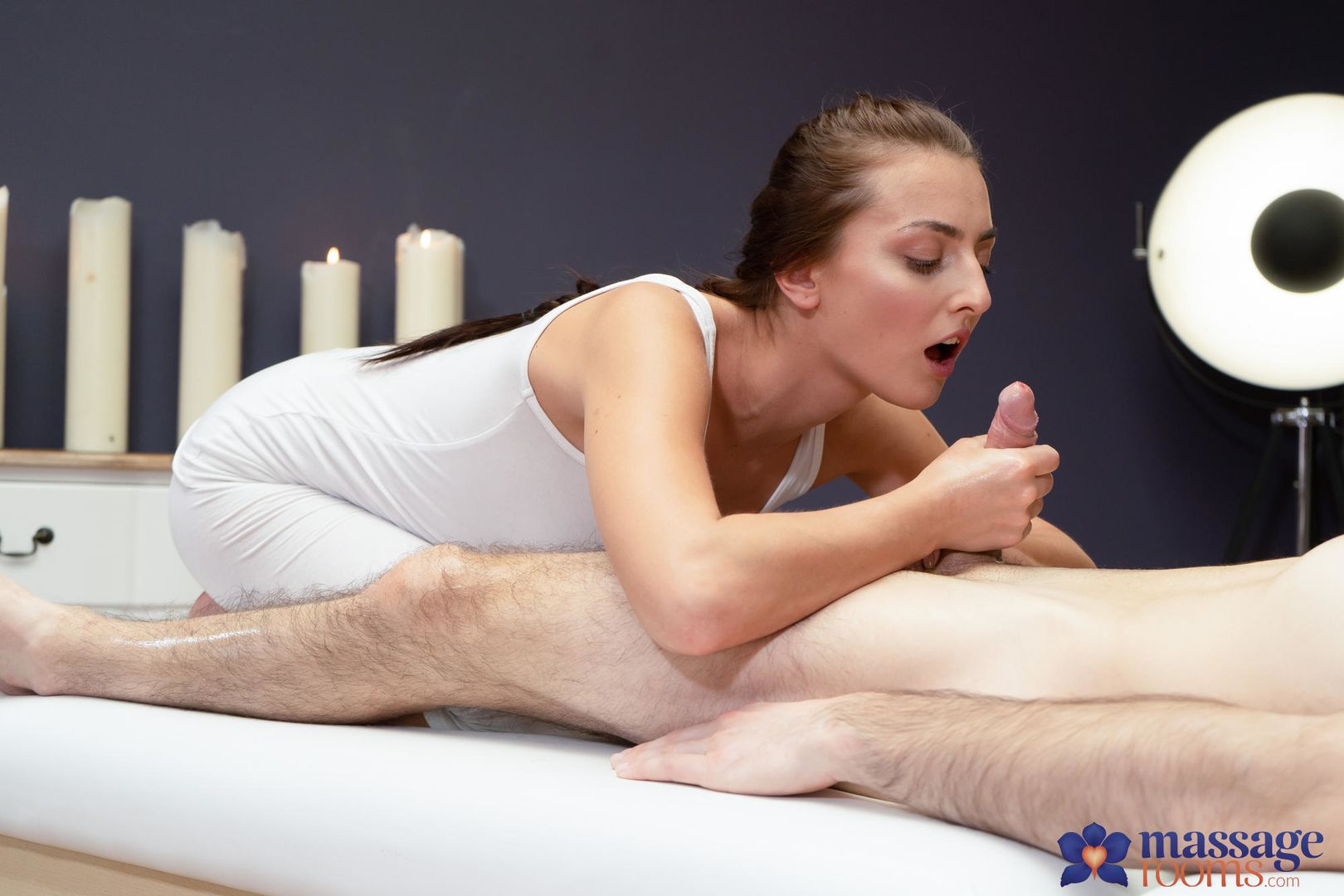 Sexy masseuse gives oily hand job