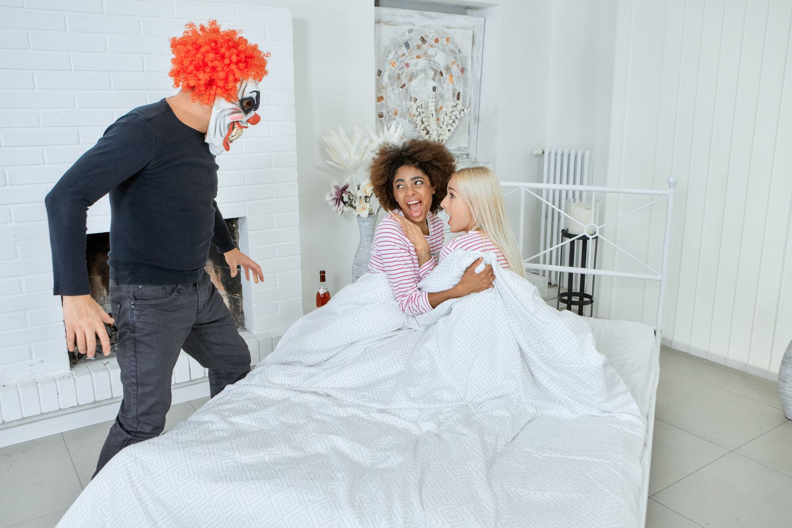 Bisexual chicks ride an evil clown